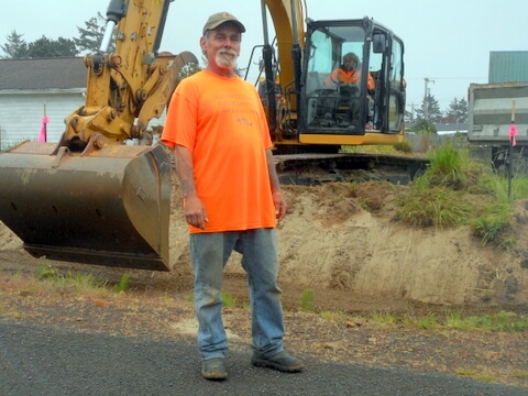 A Coastway Construction Pacific City Excavation worker